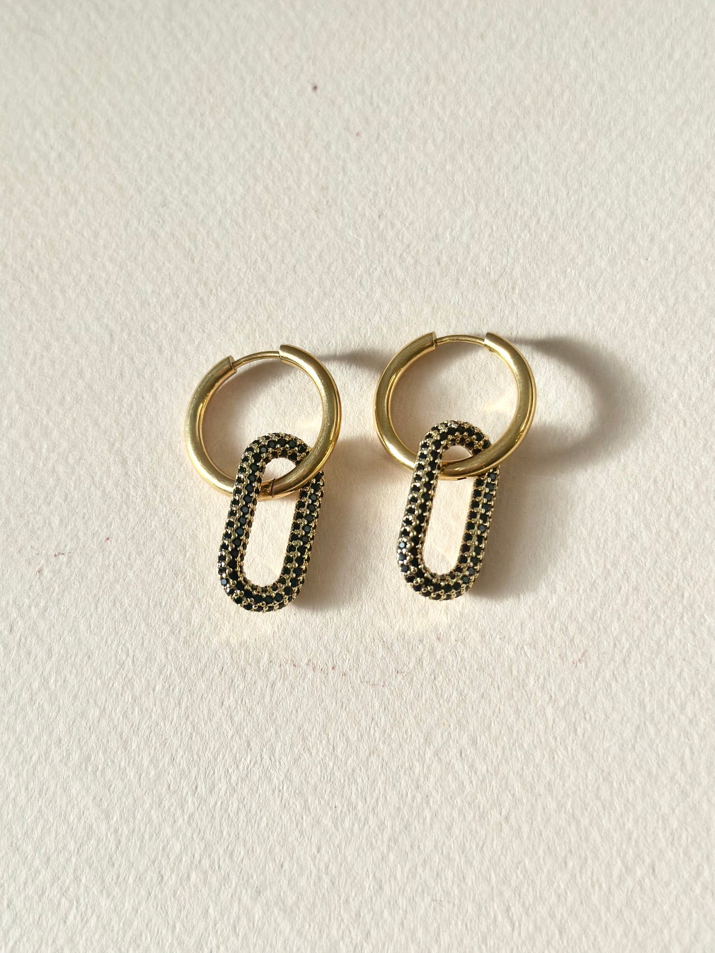 "All Things New" Stainless Steel Gold Oval Huggie Earrings - Black/Gold